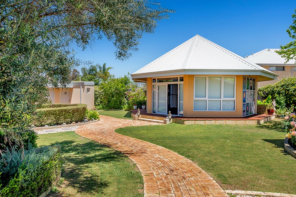 Beautiful gardens surrounding free standing octagonal one room building
