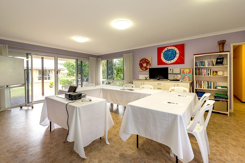 Training Room for hire at Sarah's Circle with tables, whiteboard, and projector