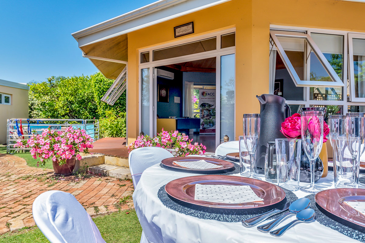 Indoor and outdoor venue hire with decorated tables and glasses for a party event