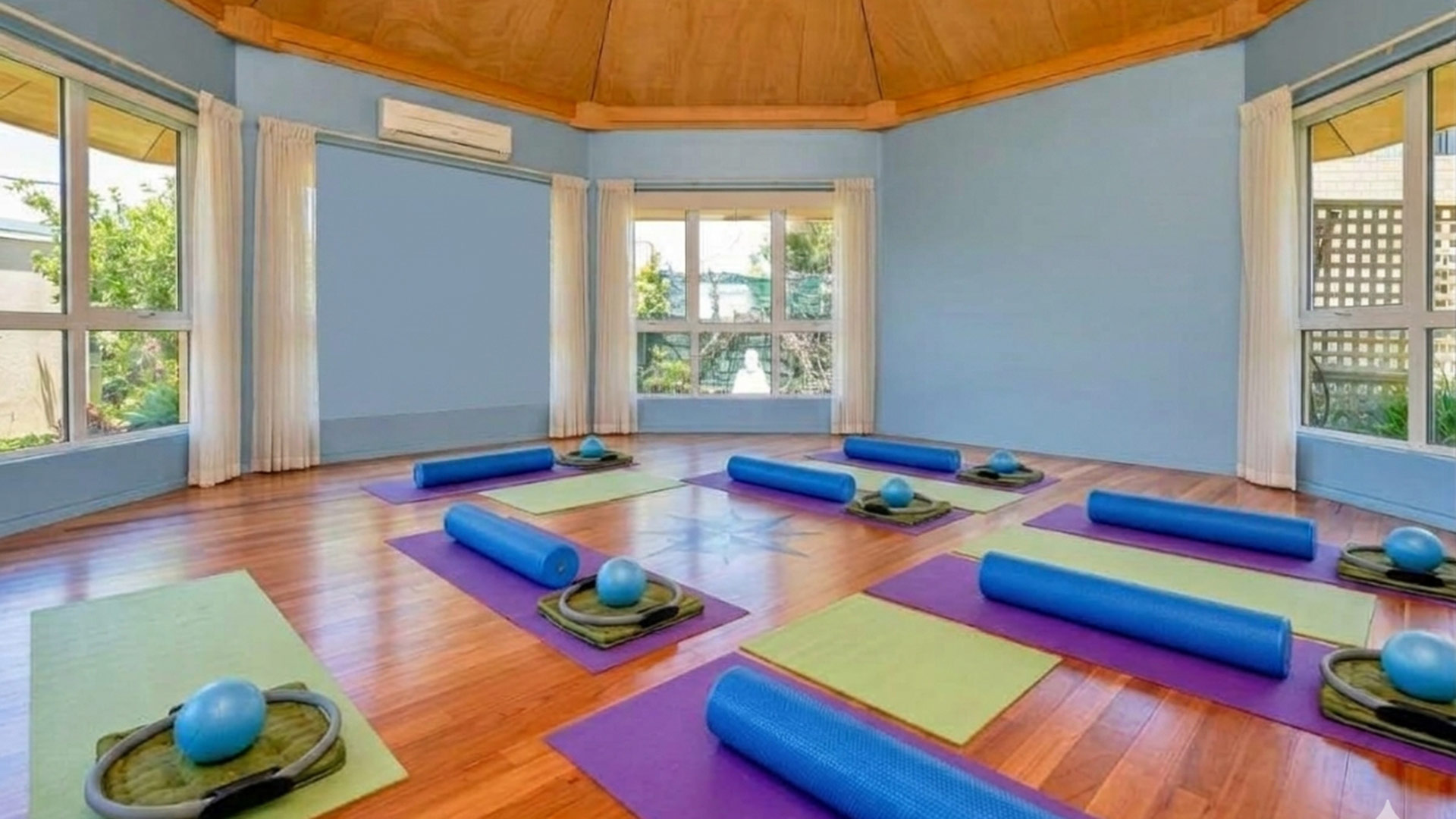 Pilates group training mats and equipment on floor of venue hire